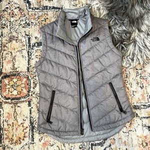 The north face grey and black zip up puff vest